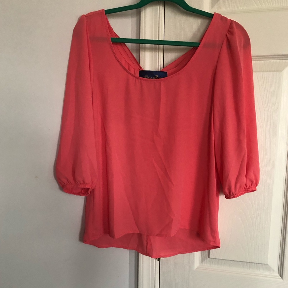 Coral blouse with back bow embellishment